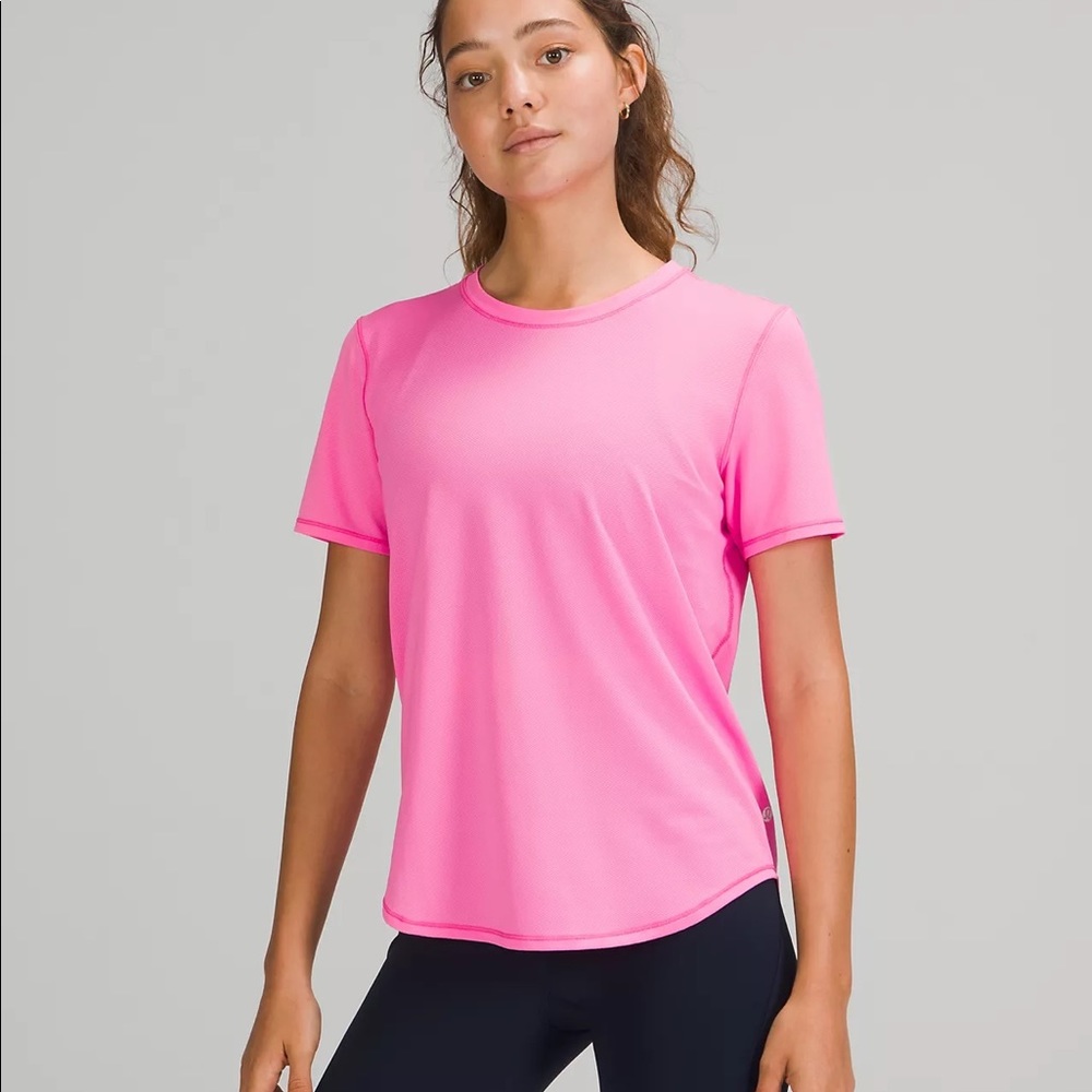 Lululemon high-neck running and training t-shirt in pow pink light.
